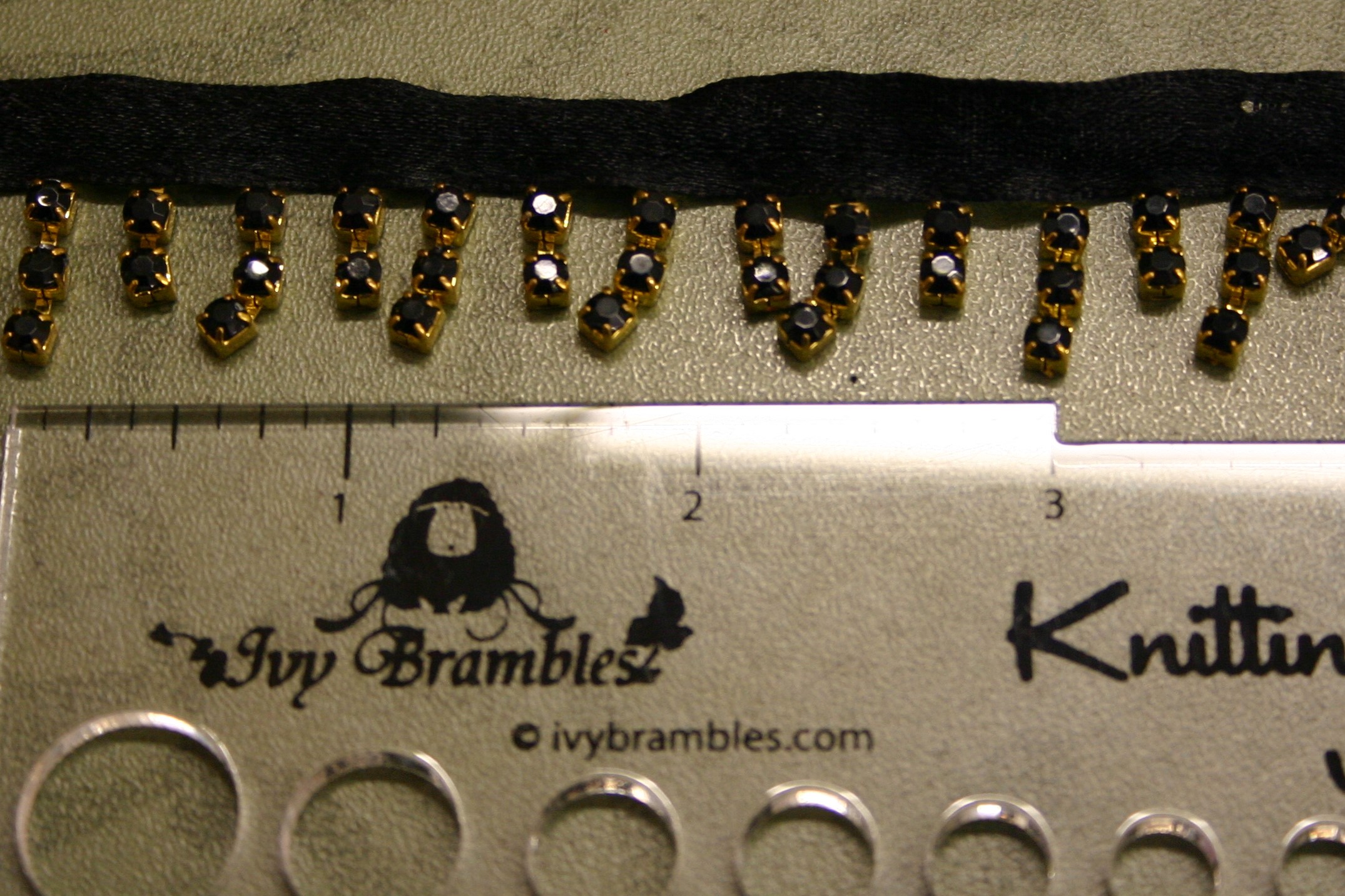 Bling Bling Trim - Black Crystal on Gold Cascading from Black Ribbon - By the Yard